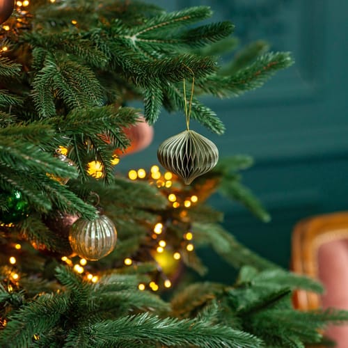 Christmas background, Christmas tree with festive balls and decorations, magic bokeh lights. Copy space, soft selective focus.